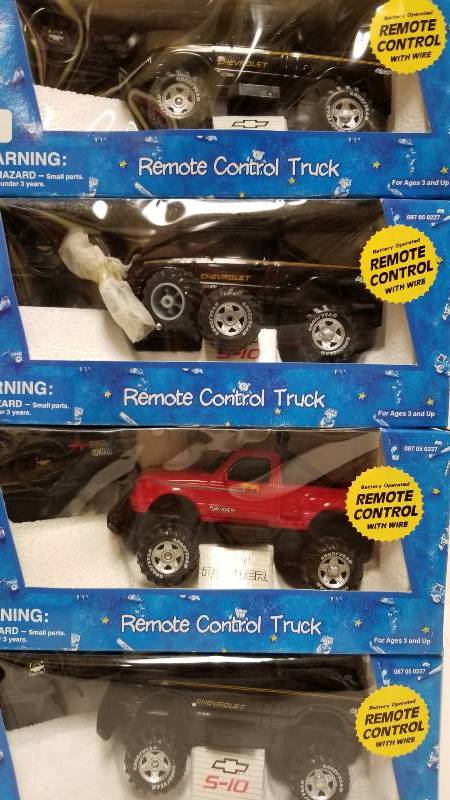 lot 1129 image: 4 Remote Control Pickups, 3 Chevy1 Ford, approx 127 scale, NIB and not tested