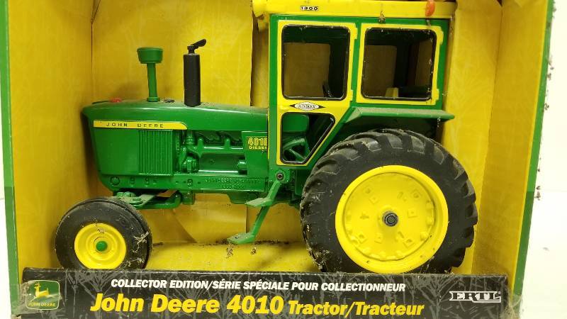 lot 1145 image: Ertl John Deere 4010 Diesel Tractor wHiniker Cab, 116 scale, # 15111A, NIB but dusty