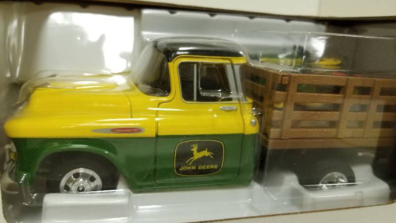 lot 1197 image: SpecCast Limited Edition 1957 Chevy Pickup wStakebedstock rack & JD riding lawn mower on board, 116 scale, 78019, NIB