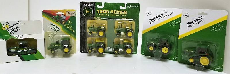 lot 1205 image: 5 Ertl 164 items, 4000 serties Tractors (4 tractors), 15216JD 4WD Tractyor, 575 JD 8400 Tractor wDuels, 5927 JD Power pull Tractor, 4092 JD 8400T Tractor, 5051, NIB