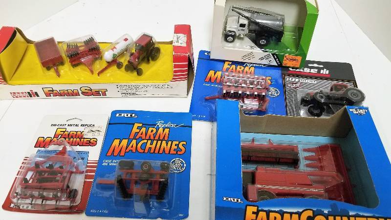 lot 1209 image: 7 Ertl 164 items, Case IH 2166 Combine, 4667Case IH Farm Set, 1379 JD Fertilizer Truck, 5544Case IH MX220 Tractor, 4431 Case IH 496 Wing Disk, 694Case IH 12 row planter, 656 Minimum tilling plow1858AO, NIB