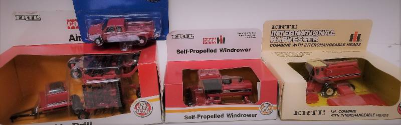 lot 1215 image: 4 Ertl 164 items, Case IH Air Drill, 444Case IH SP Windrower, 4405IH Harvester, 180 scale, 408GMC Extended Cab PU, 4386, NIB