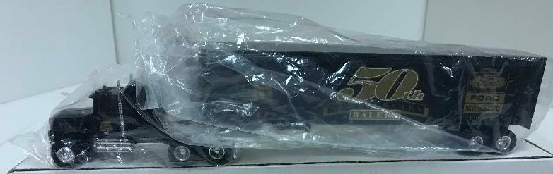 lot 1255 image: Ertl Semi New HollandFord 50th Semi, 315UO, 164 scale, See Pix for detail, NIB