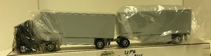 lot 1259 image: Ertl Semi, United Parcel Service Semi w2 pups, 164 scale, See Pix for detail, NIB