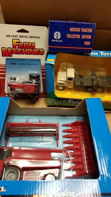 lot 1223 image: 4 Ertl items, Case IH 1666 Axial-Flow Combine w2 heads, 655, Massy Truck wduals, 1098, New Holland Genesis Tractor Collector Edition 1995, 394FA, Casi IH 2594 Tractor, 204FO, All NIB