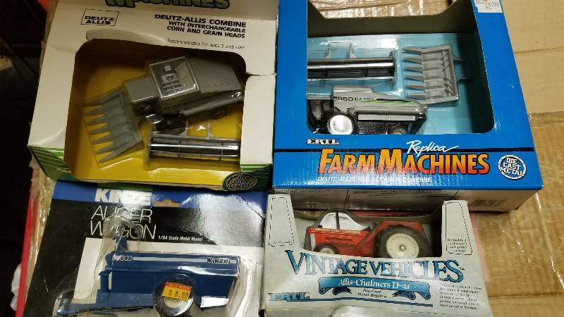 lot 1224 image: 4 ea.  164 scale, 2 each Ertl Deutz-Allis Gleaner R50 Combine w2 heads, 1284, Ertl AC D21 Tractor, 2555, 1 each KINZE 840  Auger Wagon, FP1802, All these NIB