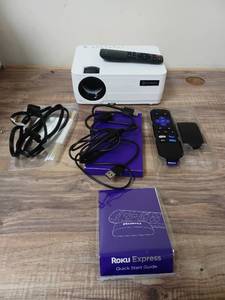 lot 2659 image: VANKYO Leisure 470 HD Mini Projector with Roku Express Streaming Player, 50000 Hrs LED Life, 240 Display Screen for Home Theater & Outdoor Movies - Retail $125.00