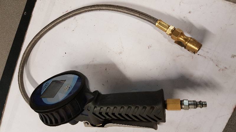 lot 1076 image: Digital read out tire pressure gauge and inflates too