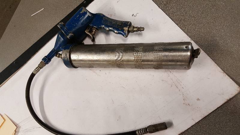lot 1079 image: Blue handle Pneumatic grease gun ready to pack it in