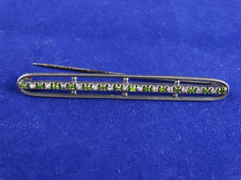 lot 2194 image: Vintage Jeweled Pin With Leather Holding Case