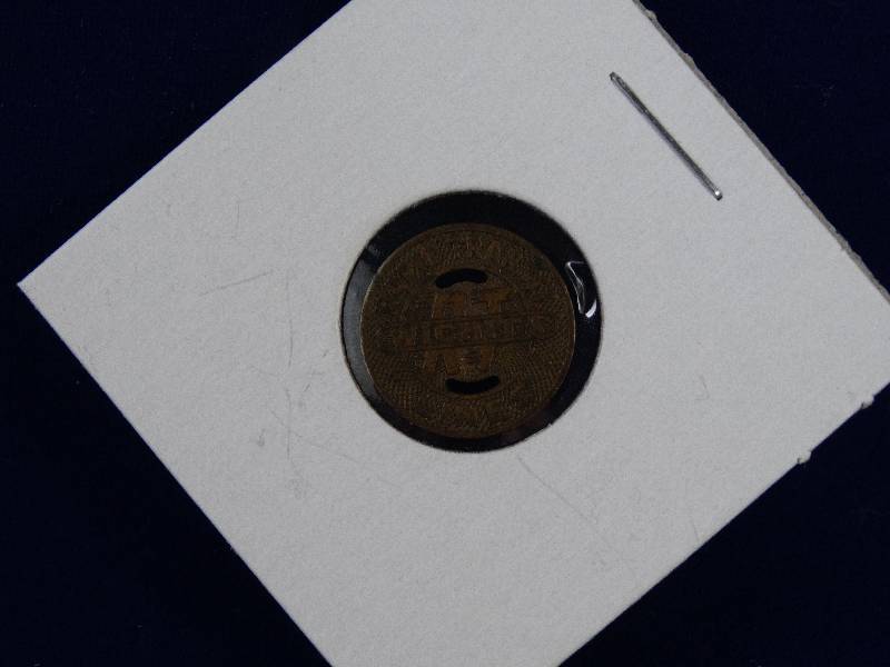 lot 2196 image: Vintage Wichita Transit Bus Token- Cool Piece of Local History