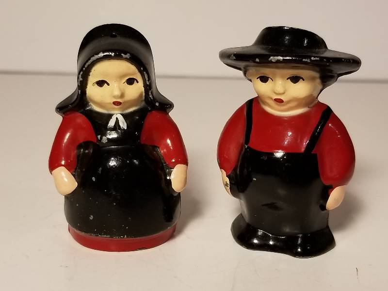 lot 29 image: Vintage cast iron Omish lady and gentleman Salt and Pepper shakers. Very cool