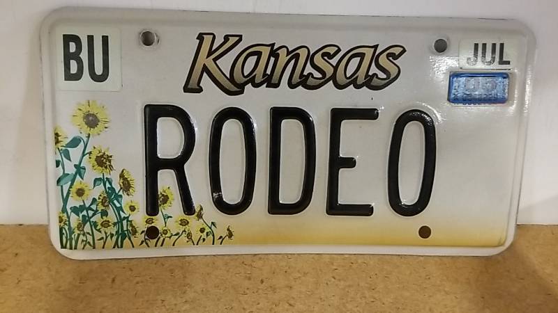 lot 4079 image: Kansas Issued License Plate  RODEO