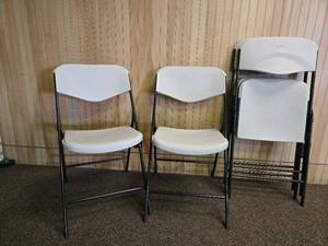 lot 24609 image: (4) Lifetime White Plastic Folding Chairs with Black Frame