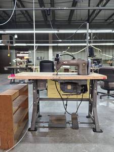 lot 13018 image: Commercial Singer Sewing Station