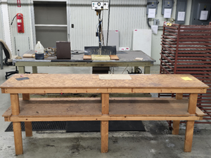 lot 17737 image: Heavy Duty Wood Workshop Table with Storage Shelves