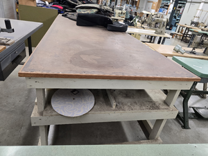 lot 17751 image: 18ft Industrial Cutting Table with Wood Top and Storage Shelves