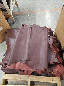 lot 14783 image: Pallet of Red Leather