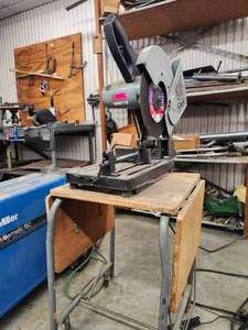 lot 8767 image: Delta 14-inch Cut-Off Saw with Stand