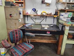 lot 44049 image: Vintage Office Desk Setup with Southwestern Pattern Chair and Metal Filing Cabinet