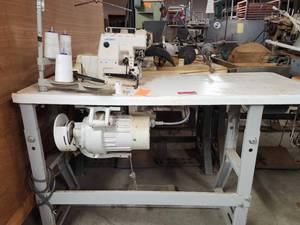 lot 44086 image: Juki Industrial Overlock Sewing Machine with Table and Motor
