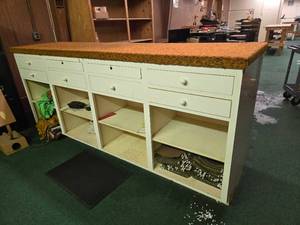 lot 42974 image: Vintage Storage Counter with Padded Top and Multiple Drawers