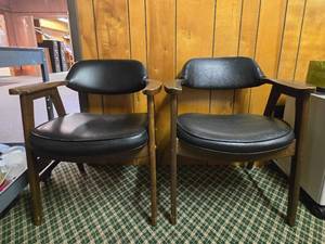 lot 48144 image: (2) Mid-Century Modern Wood Arm Chairs with Black Vinyl Upholstery