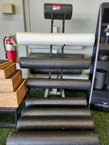 lot 21040 image: Foam Roller Storage Rack with Multiple Rollers
