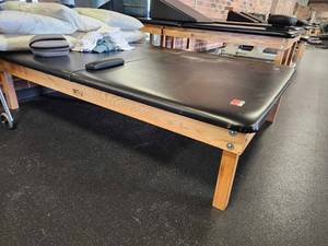 lot 21075 image: Tru Medical Furniture Treatment Table with Wood Base