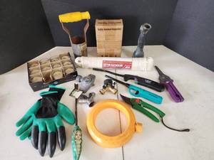 lot 300 image: Garden Tools and Supplies - Solar Repeller, Clothesline, Gloves, Candles