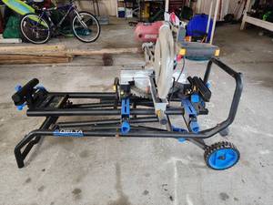 lot 5 image: Chicago Electric 12 Double-Bevel Sliding Compound Miter Saw with Delta Universal Stand - Powers On