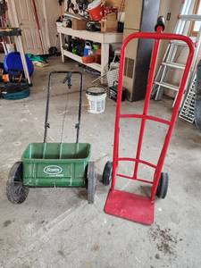 lot 562 image: Scotts AccuGreen 1000 Drop Spreader and Red Hand Truck
