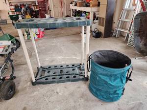 lot 563 image: Rubbermaid Tool Storage Rack and Pop-Up Garden Bag