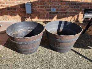 lot 912 image: 2 Half Whiskey Barrel Planters - Plastic - 22in x 14in