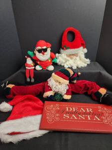lot 701 image: Santa Christmas Decorations - Santa Draft Stopper, Door Hanger, Wood Sign and More