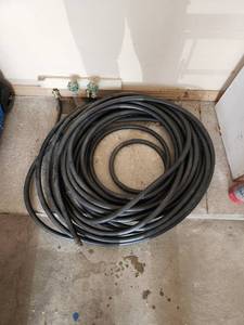 lot 757 image: Heavy Duty Black Rubber Water Hose