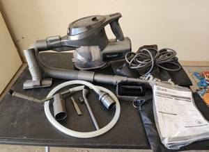 lot 777 image: Shark Rocket Handheld Vacuum with Attachments and Manual