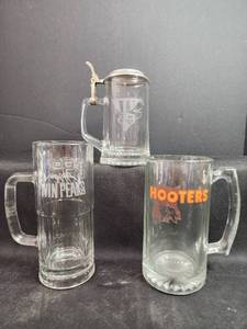 lot 214 image: Collectible Beer Mugs - Winston, Twin Peaks, Hooters Logo Glass Set