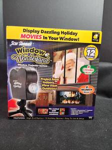 lot 260 image: Star Shower Window Wonderland Projector System with 12 Holiday Movies
