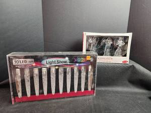 lot 282 image: LED Holiday Light Sets - 10 LED Icicle Light Show and 3 Angel Lights