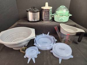 lot 117 image: Kitchen Essentials Bundle - Crock-Pot, Dash Egg Cooker, Grater, Measuring Cup, Strainer & Silicone Lids