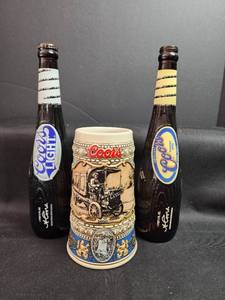 lot 162 image: Coors 1910 Commemorative Beer Stein with Coors Collectible Bottles- Bottles for decor only