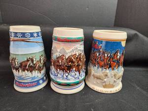 lot 163 image: Budweiser Holiday Beer Steins Collection - Set of 3 Ceramic Mugs