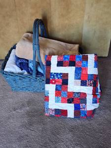 lot 822 image: Patriotic Quilt with Blue Wicker Basket and Assorted Bedding