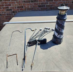 lot 925 image: Decorative Lighthouse Solar Light, 2 Solar Light Stakes, and 2 Small Shepherds Hooks