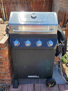 lot 937 image: Nexgrill 4-Burner Propane Gas Grill with Temperature Gauge and Grill Cover