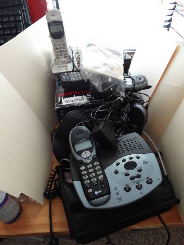 lot 213 image: Large lot of cordless phones and an auto bag phone, radar detector