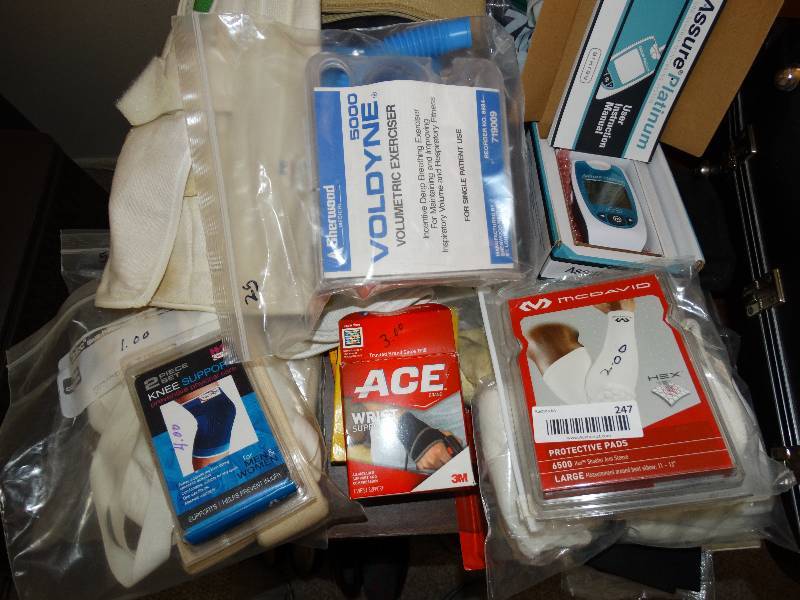 lot 247 image: Large lot of armleg braces, gluecose meter, health accessories, ect.