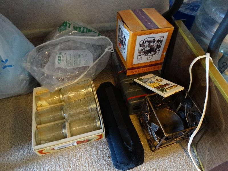 lot 268 image: Canning jars, ankle weights, oxygen tubing, hair nets, lantern, candle holder and warming tray
