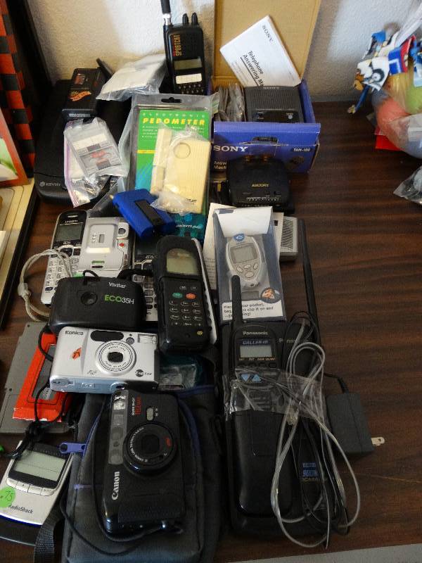 lot 289 image: Large lot of phones, cameras, VHS rewinder and answering machine